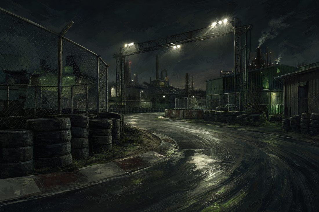A floodlit night racing circuit running through an industrial estate with chain-link fencing, gantries and unevenly stacked tyre barriers
